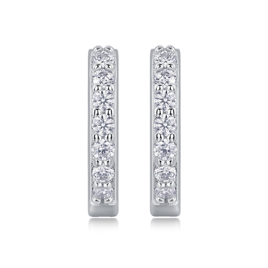 Pair of diamond hoop earrings on a white background