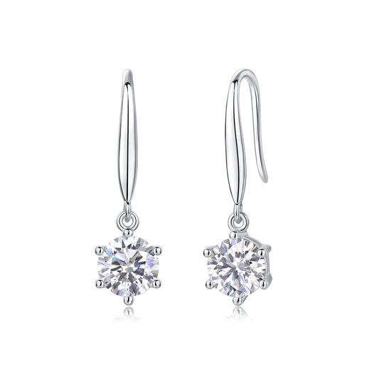 Pair of silver earrings with clear gemstones on a white background